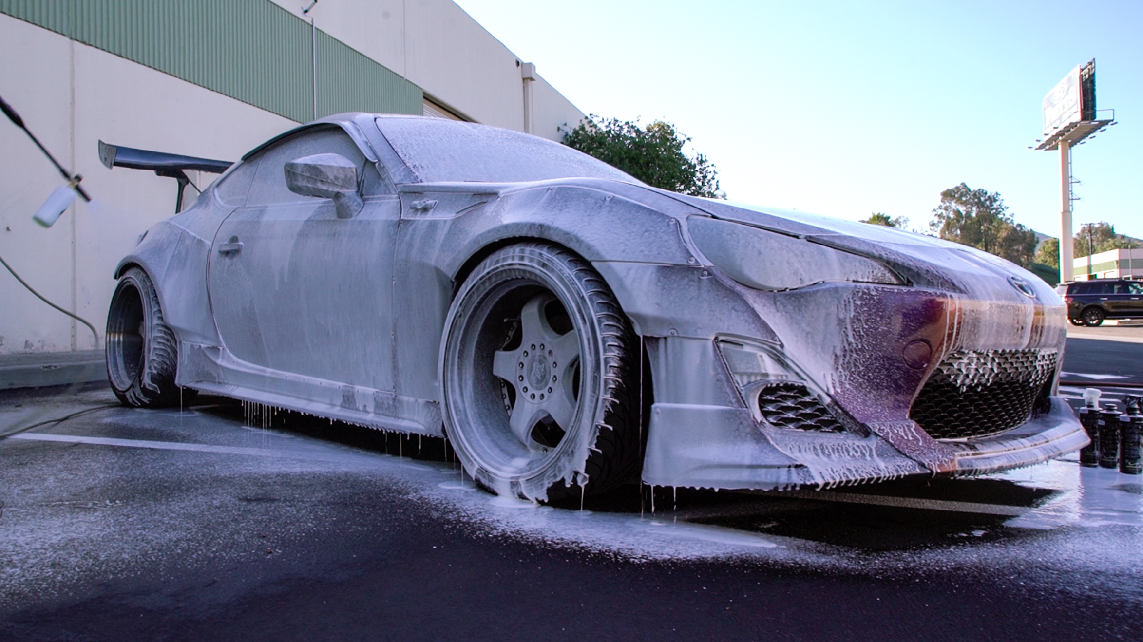 Photo: Christian - @premiumchristian /// In Photo:  Anthony @premiumanthony /// Widebody FRS being washed by owner fully covered in foaming shampoo.